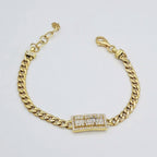 Gourmette Maille Cubaine Or Jaune - Plaque Sertie de Pierres Baguettes – or 18 carats | Tariki
